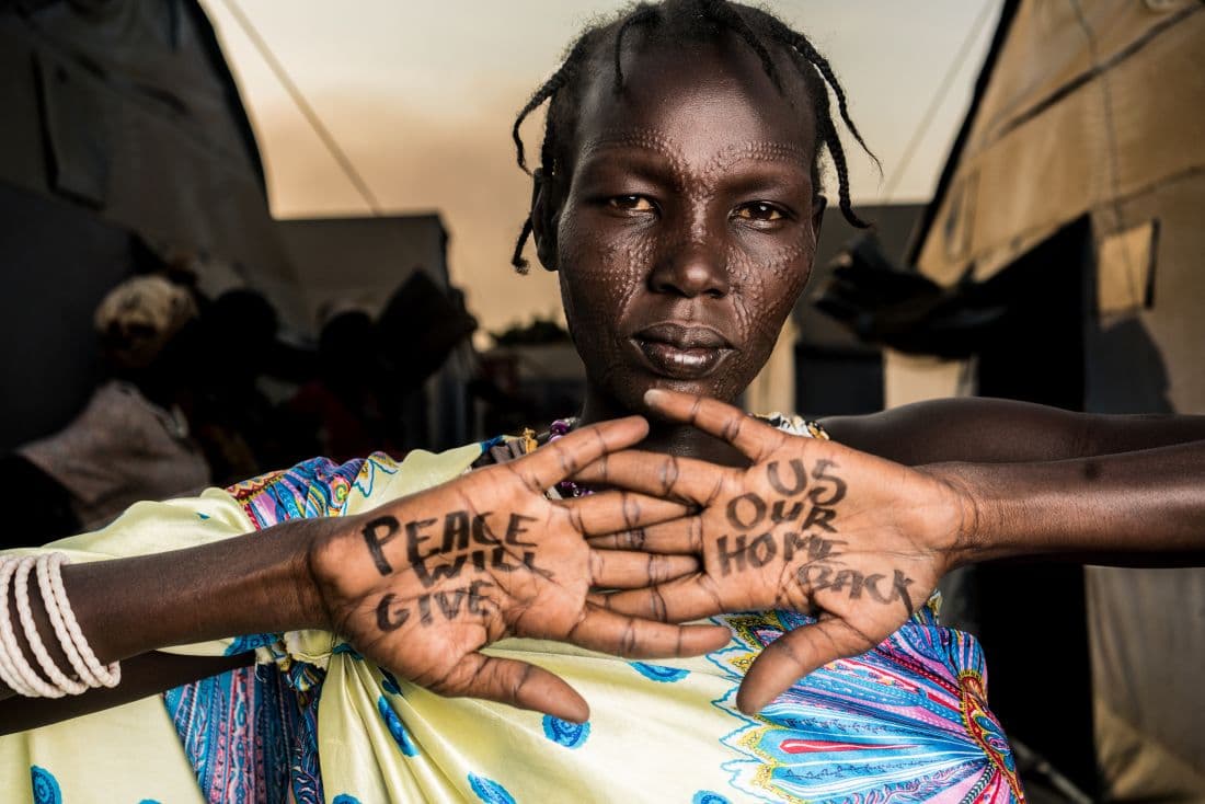 Dear World portrait — message written on skin